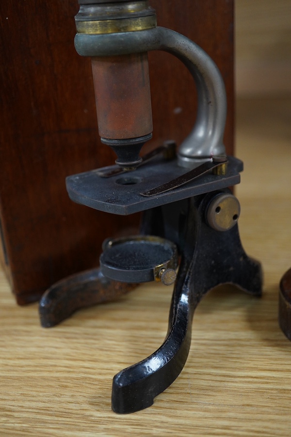 A small mahogany cased microscope, microscope 24cm high. Condition - case good microscope well used